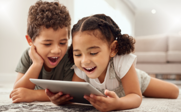 young children on tablet device